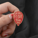 We all float down here enamel pin